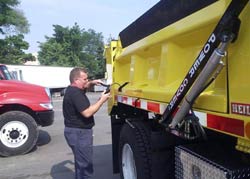 Man greasing truck