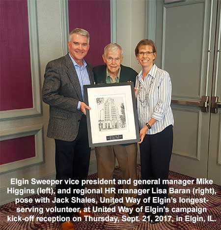 Elgin's Mike Higgins Accepts Award